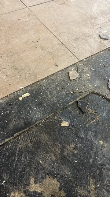 Black bitumen mastic floor removal in a NW7 flat
